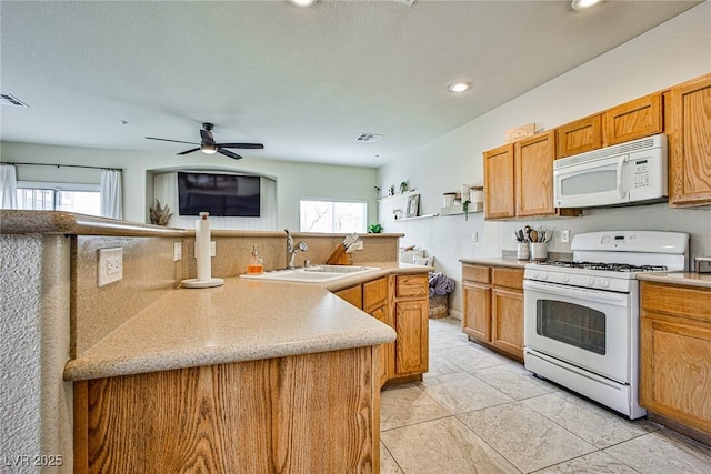 4833 Straight Flush Dr Unit 103, Las Vegas, NV 89122 - kitchen featuring white appliances, a sink, recessed lighting, ceiling fan, and light tile patterned floors