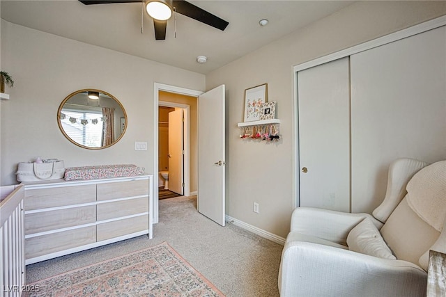 4833 Straight Flush Dr Unit 103, Las Vegas, NV 89122 - bedroom with light carpet, a closet, baseboards, and ceiling fan