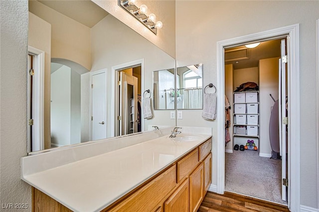 4833 Straight Flush Dr Unit 103, Las Vegas, NV 89122 - bathroom featuring vanity, wood finished floors, and baseboards