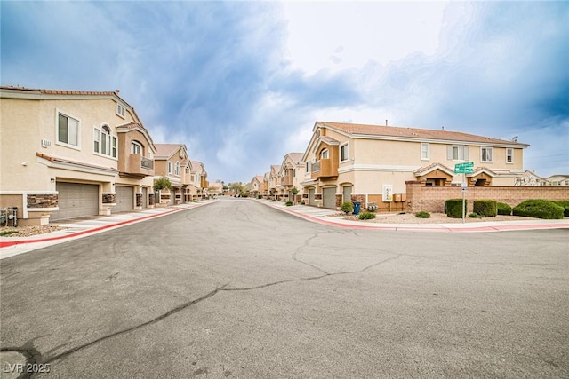4833 Straight Flush Dr Unit 103, Las Vegas, NV 89122 - view of asphalt road featuring sidewalks, a residential view, and curbs