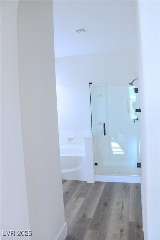 8616 Willow Cabin St, Las Vegas, NV 89131 - full bathroom with a shower stall, wood finished floors, and a garden tub