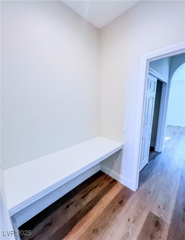 8616 Willow Cabin St, Las Vegas, NV 89131 - mudroom featuring arched walkways, wood finished floors, and baseboards