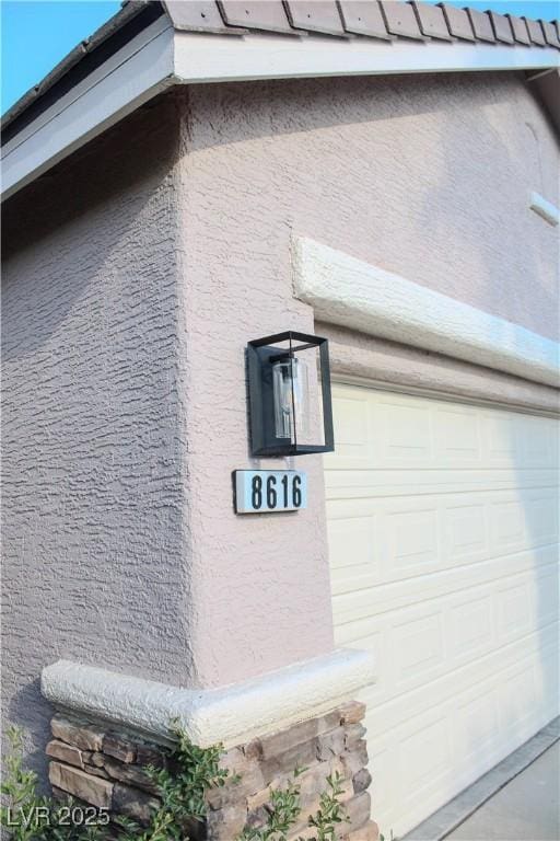 8616 Willow Cabin St, Las Vegas, NV 89131 - view of home's exterior with a garage and stucco siding