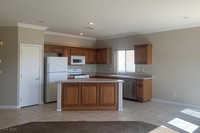 6412 Starling Mesa St, North Las Vegas, NV 89086 - kitchen with white appliances, light tile patterned flooring, light countertops, a kitchen island, and crown molding
