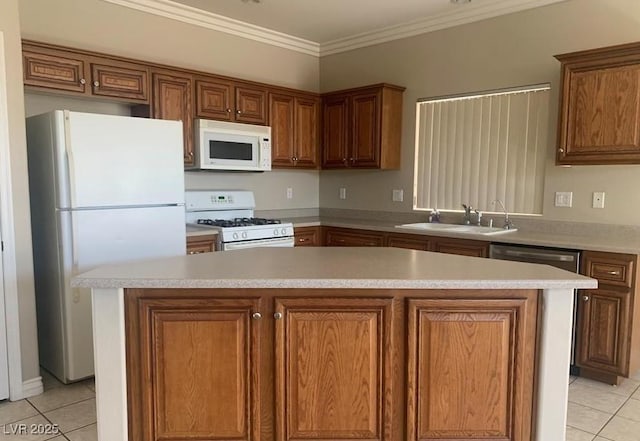 6412 Starling Mesa St, North Las Vegas, NV 89086 - kitchen with white appliances, a sink, light tile patterned floors, light countertops, and ornamental molding