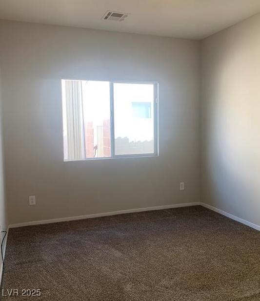 6412 Starling Mesa St, North Las Vegas, NV 89086 - carpeted spare room with baseboards