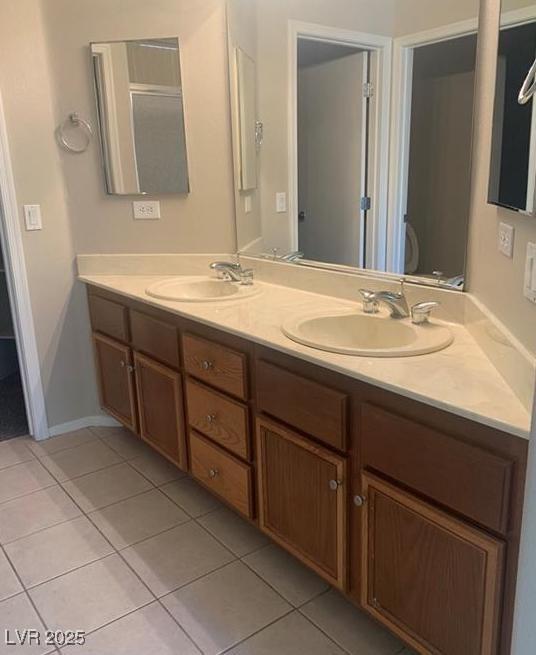 6412 Starling Mesa St, North Las Vegas, NV 89086 - bathroom with tile patterned flooring and double vanity