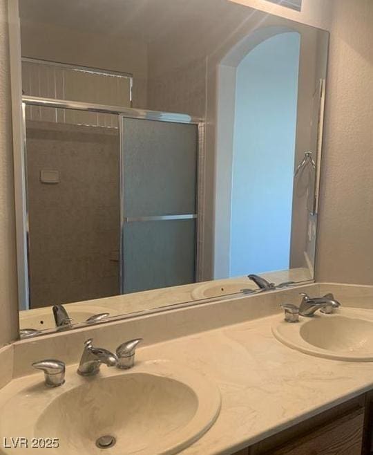 6412 Starling Mesa St, North Las Vegas, NV 89086 - full bathroom with double vanity and a shower with shower door