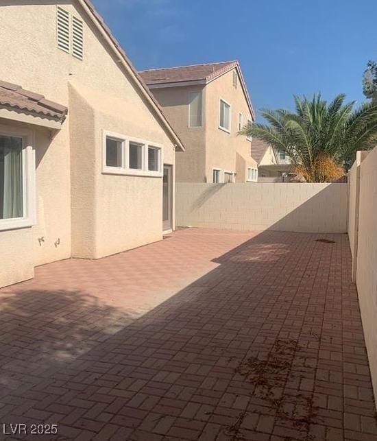 6412 Starling Mesa St, North Las Vegas, NV 89086 - fenced backyard with a patio area