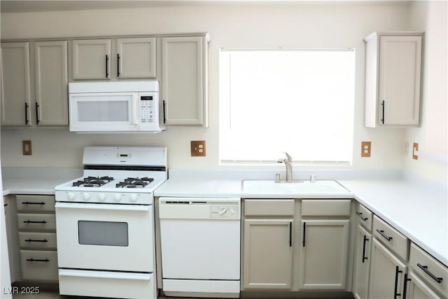 5112 Foggia Ave, Las Vegas, NV 89130 - kitchen featuring white appliances, a sink, light countertops, and gray cabinets
