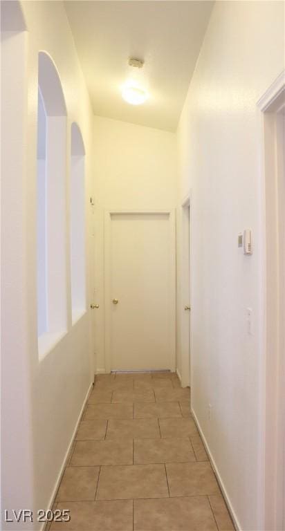5112 Foggia Ave, Las Vegas, NV 89130 - corridor featuring light tile patterned floors and baseboards
