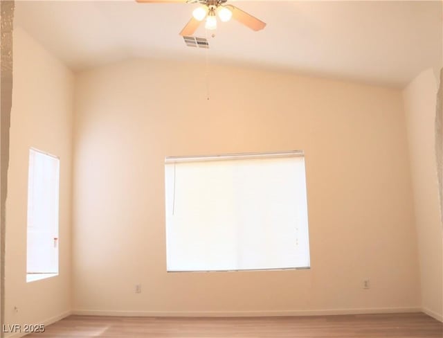 5112 Foggia Ave, Las Vegas, NV 89130 - unfurnished room with light wood-style flooring, a ceiling fan, vaulted ceiling, and baseboards