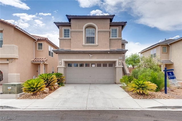 8745 Dodds Canyon St, Las Vegas, NV 89131 - view of front of property featuring stucco siding, an attached garage, concrete driveway, and a tiled roof
