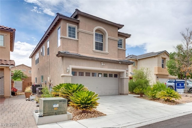 8745 Dodds Canyon St, Las Vegas, NV 89131 - view of front facade featuring a garage, stucco siding, and concrete driveway