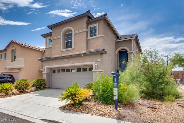 8745 Dodds Canyon St, Las Vegas, NV 89131 - view of front of home featuring a garage, stucco siding, and driveway