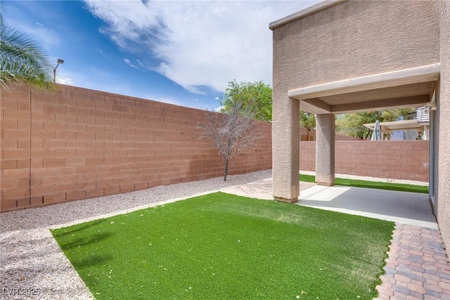 8745 Dodds Canyon St, Las Vegas, NV 89131 - fenced backyard with a patio