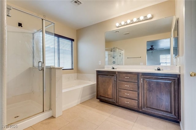 8745 Dodds Canyon St, Las Vegas, NV 89131 - bathroom featuring a bath, tile patterned floors, a stall shower, double vanity, and a ceiling fan