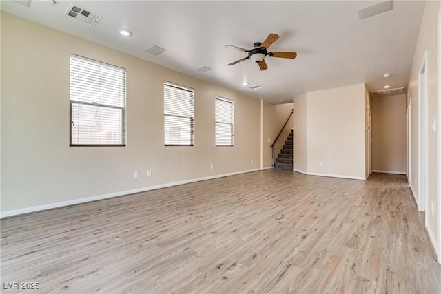 8745 Dodds Canyon St, Las Vegas, NV 89131 - unfurnished living room with light wood finished floors, a ceiling fan, recessed lighting, and stairway
