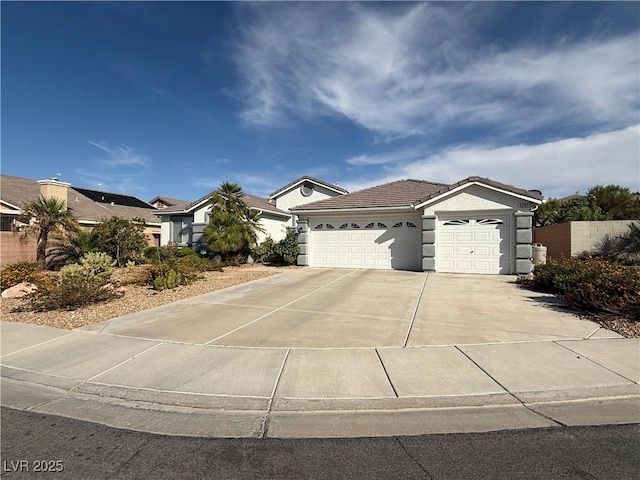 2267 Muir Ct, Henderson, NV 89052 - single story home featuring a garage, driveway, stucco siding, and a tiled roof