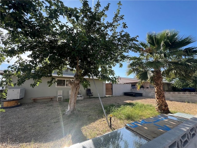 1429 S Sandhill Rd, Las Vegas, NV 89104 - view of property hidden behind natural elements with stucco siding