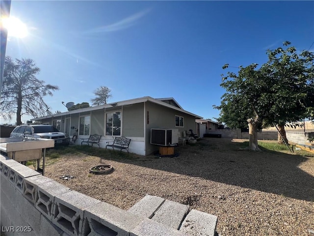 1429 S Sandhill Rd, Las Vegas, NV 89104 - view of home's exterior with an outdoor fire pit