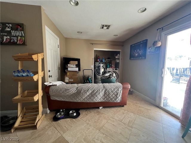 1429 S Sandhill Rd, Las Vegas, NV 89104 - living area with healthy amount of natural light, baseboards, and washer / dryer
