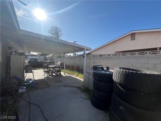 1429 S Sandhill Rd, Las Vegas, NV 89104 - fenced backyard featuring outdoor dining space and a patio area