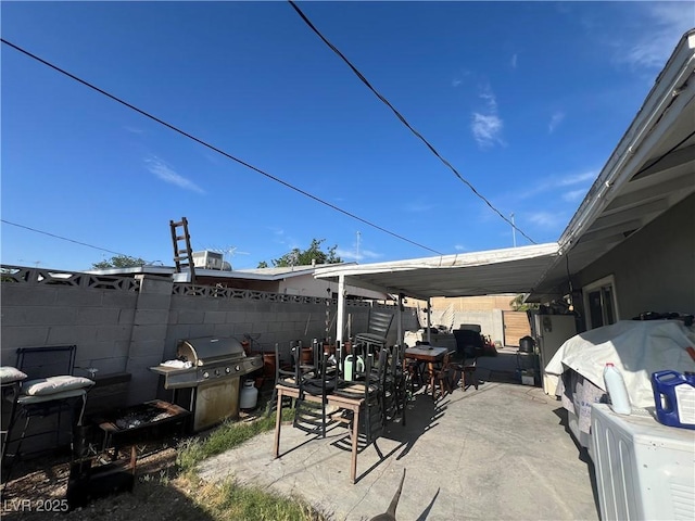 1429 S Sandhill Rd, Las Vegas, NV 89104 - view of patio with outdoor dining space and area for grilling