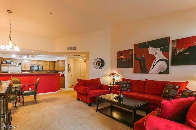 8777 Maule Ave Unit 3116, Las Vegas, NV 89148 - living area with light carpet and a chandelier