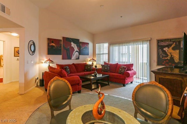 8777 Maule Ave Unit 3116, Las Vegas, NV 89148 - carpeted living room with baseboards and high vaulted ceiling