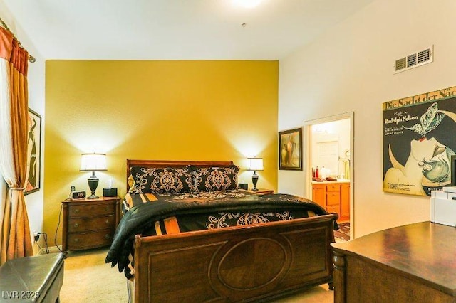 8777 Maule Ave Unit 3116, Las Vegas, NV 89148 - bedroom with ensuite bath, carpet floors, and lofted ceiling