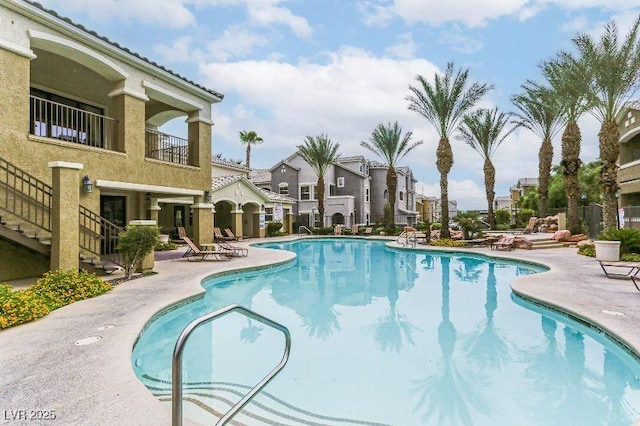 8777 Maule Ave Unit 3116, Las Vegas, NV 89148 - community pool featuring a patio area, stairway, and a residential view