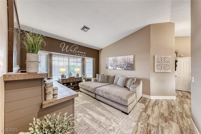 7670 Descanso Ln, Las Vegas, NV 89123 - living room with lofted ceiling and wood finished floors