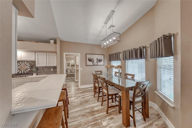 7670 Descanso Ln, Las Vegas, NV 89123 - dining room with light wood finished floors and a chandelier