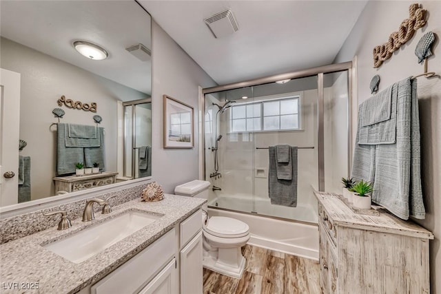 7670 Descanso Ln, Las Vegas, NV 89123 - bathroom with vanity, bath / shower combo with glass door, and wood finished floors