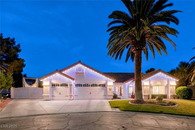 7670 Descanso Ln, Las Vegas, NV 89123 - view of front facade featuring an attached garage, driveway, and stucco siding