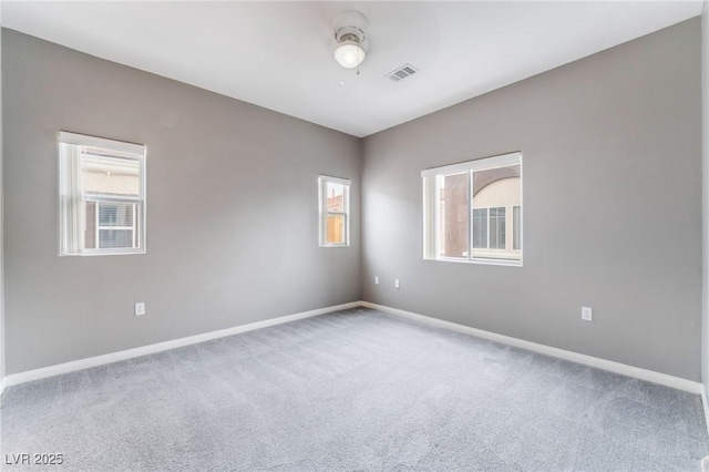 9303 Gilcrease Ave Unit 1013, Las Vegas, NV 89149 - spare room featuring carpet, healthy amount of natural light, and baseboards