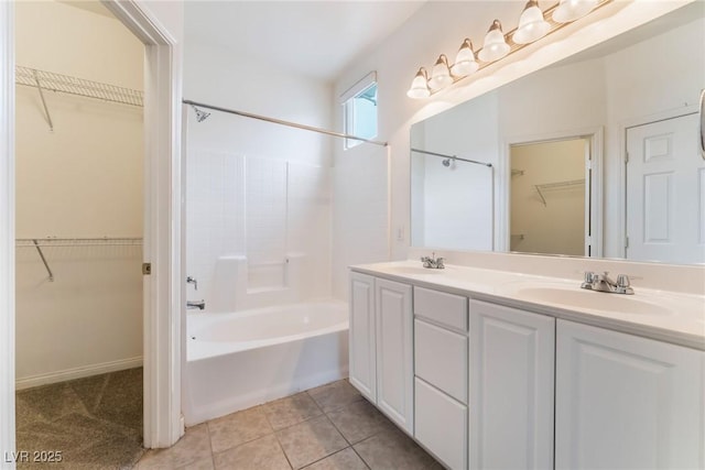 9303 Gilcrease Ave Unit 1013, Las Vegas, NV 89149 - full bath with tub / shower combination, double vanity, a spacious closet, and tile patterned floors