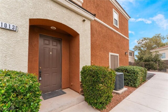 9303 Gilcrease Ave Unit 1013, Las Vegas, NV 89149 - entrance to property featuring central AC unit and stucco siding