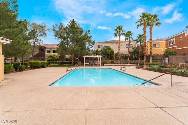 9303 Gilcrease Ave Unit 1013, Las Vegas, NV 89149 - community pool with a pergola, a patio area, and a residential view