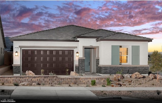 121 Piano Ln Lot 198, Henderson, NV 89015 - view of front of house with an attached garage, stucco siding, and brick siding