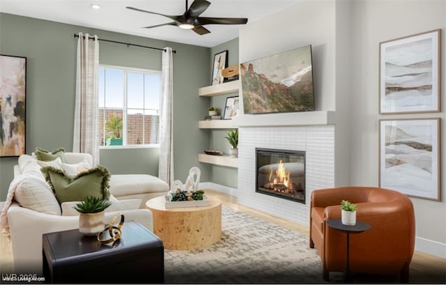121 Piano Ln Lot 198, Henderson, NV 89015 - living area featuring a ceiling fan, a tiled fireplace, baseboards, wood finished floors, and recessed lighting