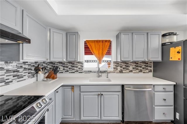 1589 Silver Mesa Way, Las Vegas, NV 89169 - kitchen featuring appliances with stainless steel finishes, a sink, gray cabinets, and tasteful backsplash