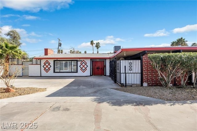 1589 Silver Mesa Way, Las Vegas, NV 89169 - view of front of house featuring a fenced front yard, concrete driveway, and a gate
