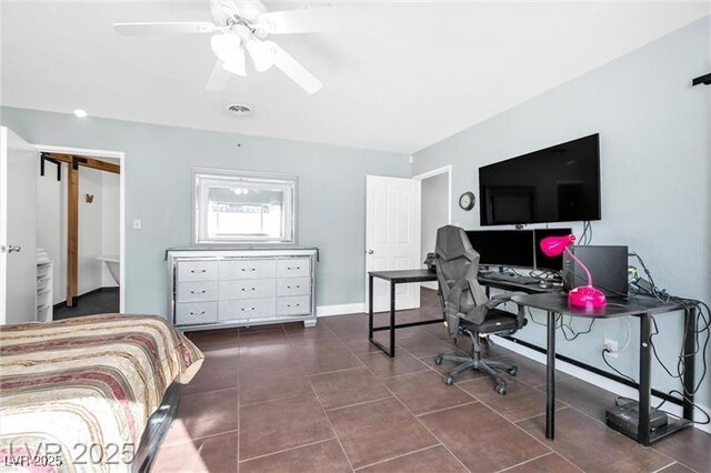 1589 Silver Mesa Way, Las Vegas, NV 89169 - bedroom with dark tile patterned flooring, a desk, and ceiling fan