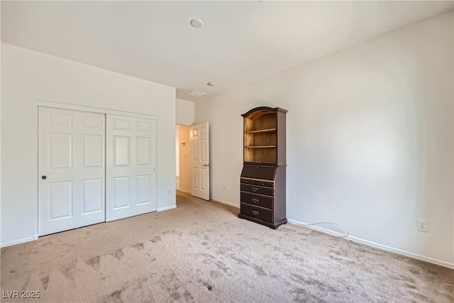 7465 Widewing Dr, North Las Vegas, NV 89084 - unfurnished bedroom with carpet flooring, a closet, and baseboards