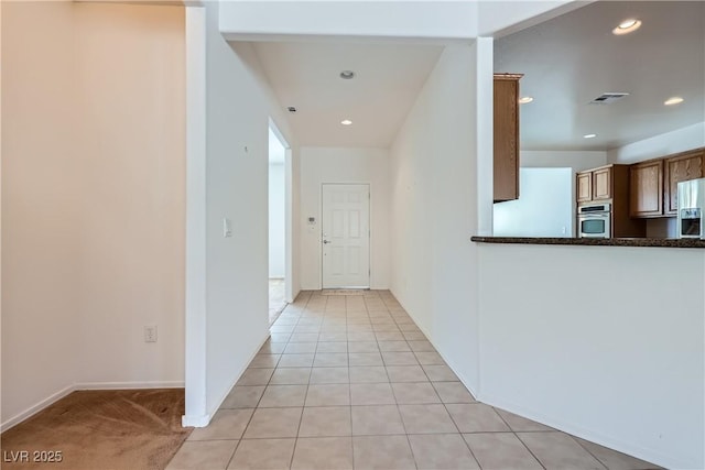 7465 Widewing Dr, North Las Vegas, NV 89084 - hallway featuring recessed lighting, baseboards, and light tile patterned floors