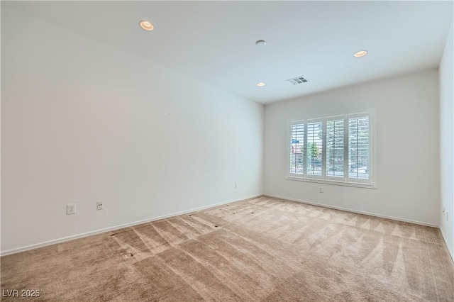 7465 Widewing Dr, North Las Vegas, NV 89084 - spare room with light colored carpet, recessed lighting, and baseboards