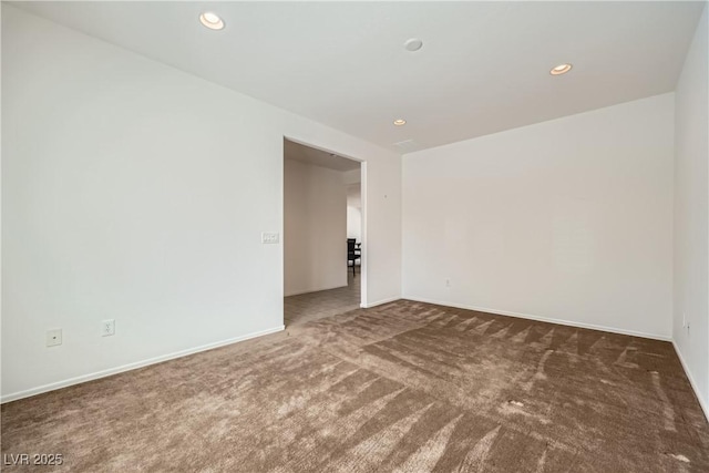 7465 Widewing Dr, North Las Vegas, NV 89084 - carpeted spare room with baseboards and recessed lighting