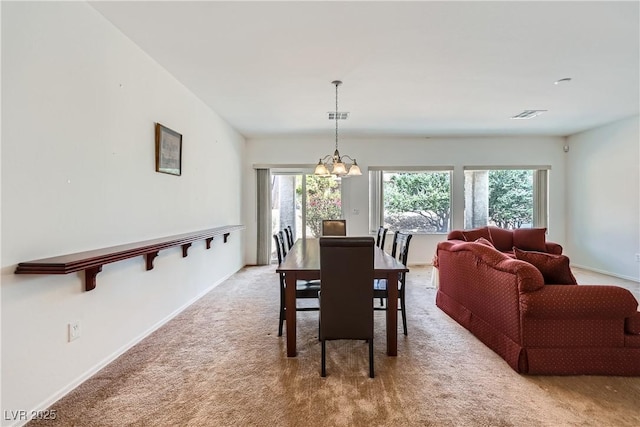 7465 Widewing Dr, North Las Vegas, NV 89084 - dining area featuring a chandelier, light colored carpet, and baseboards